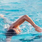 Swimming Skills - A Person Doing a Freestyle Swimming in the Pool