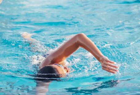 Swimming Skills - A Person Doing a Freestyle Swimming in the Pool