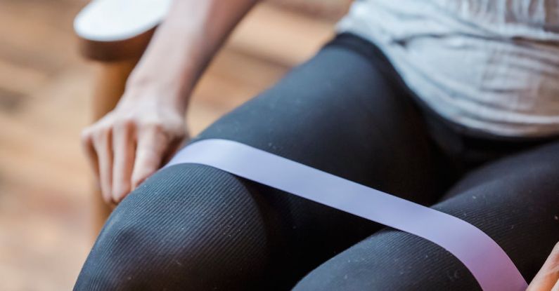 Resistance Training - Crop sportswoman exercising with resistance band