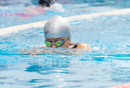 Solo Swimmers - A swimmer in a pool with goggles on