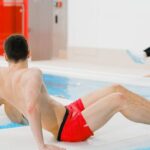 Water Aerobics - People Exercising on Floating Boards in a Swimming Pool