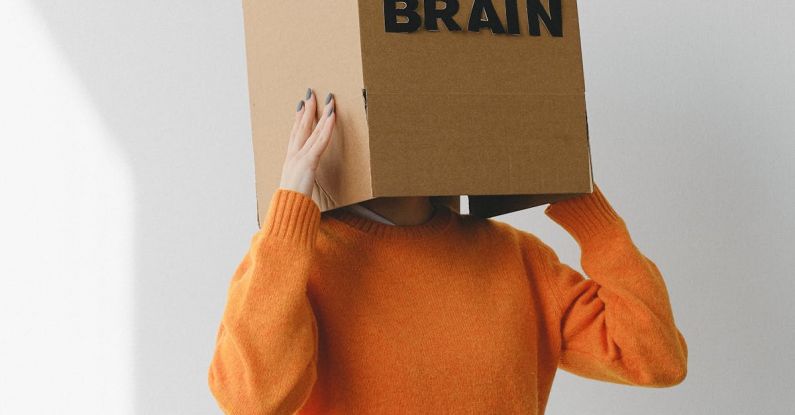 Lung Capacity - Crop person putting Idea title in cardboard box with Brain inscription on head of female on light background