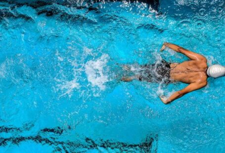 Water Games - Person Swimming on Body of Water