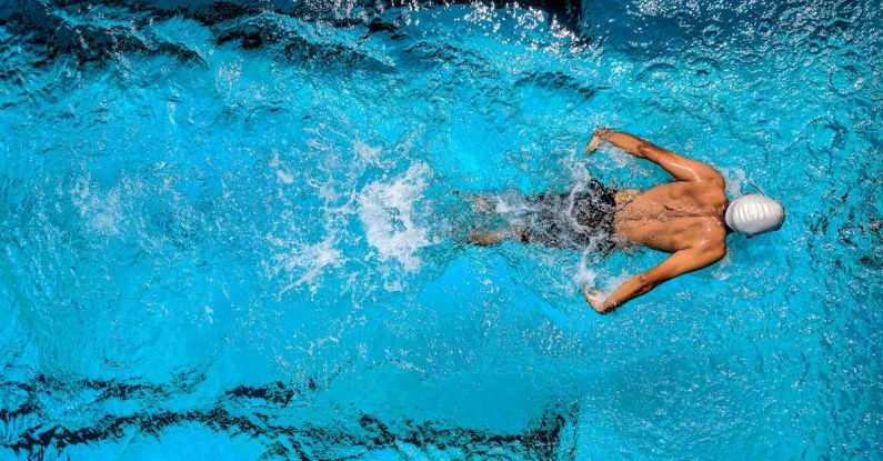 Water Games - Person Swimming on Body of Water