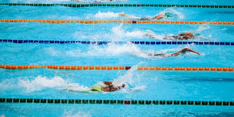 Pool Games - People Doing Swim Race