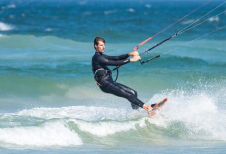 Wetsuit - Man Parasailing While Wearing Wetsuit