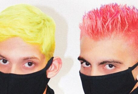 Breath Control - Unrecognizable men with colorful stylish haircuts in medical masks