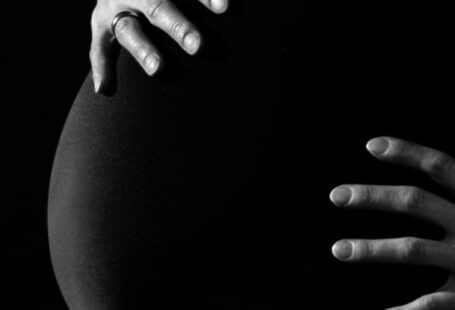 Pregnant Women - Gray Scale Photo of a Pregnant Woman