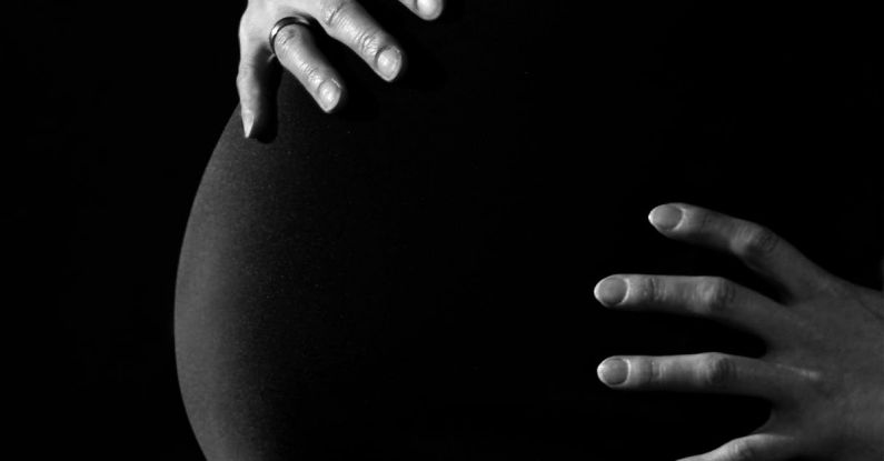 Pregnant Women - Gray Scale Photo of a Pregnant Woman